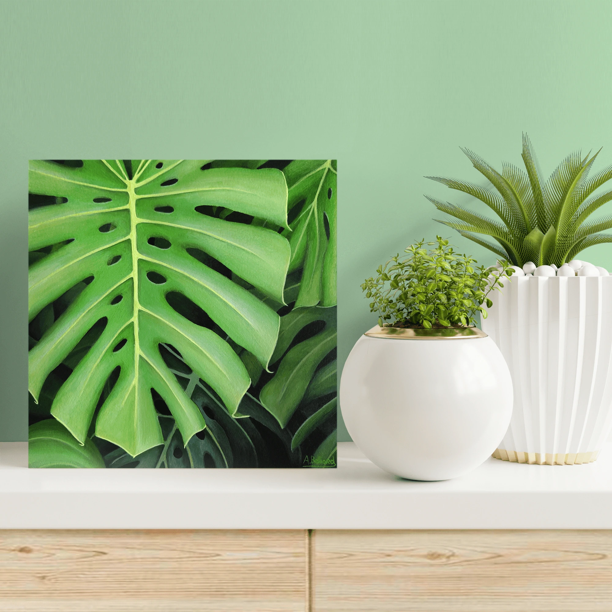 Décoration tropicale et exotique avec un Petit tableau de feuillage de plante monstera deliciosa.