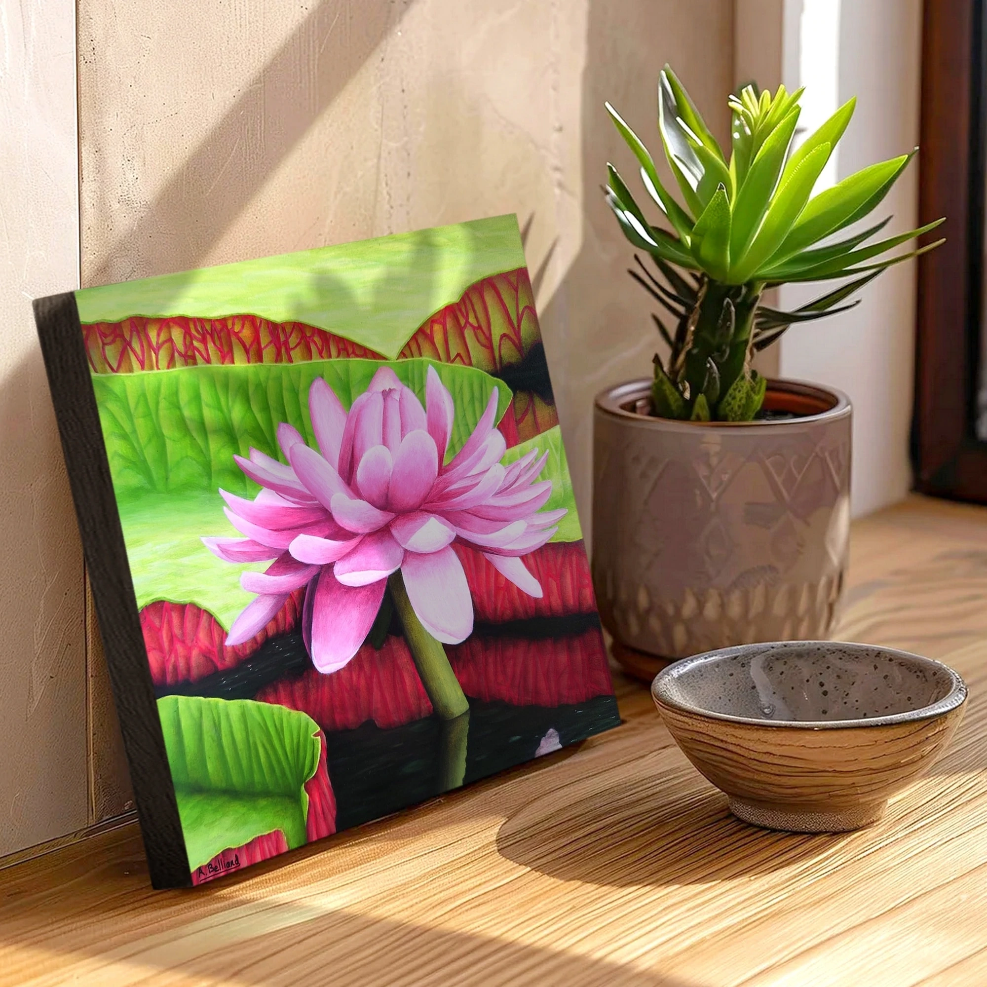 Peinture d'une fleur rose de nénuphar posée sur un meuble pour un style tropical exotique