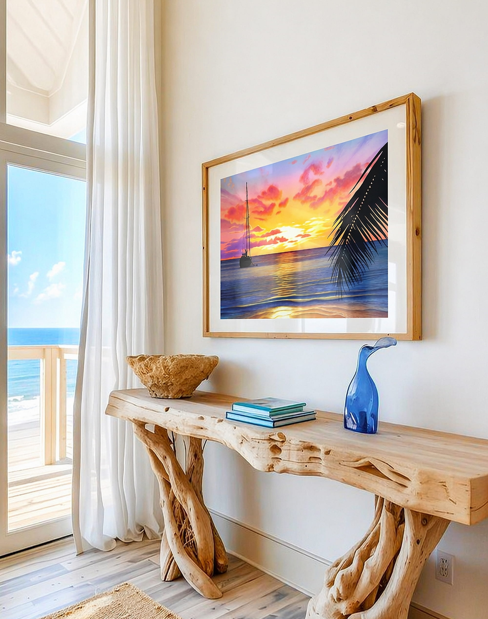 Affiche d’un coucher de soleil tropical avec bateau sur la mer accrochée dans une maison lumineuse face à l’océan dans une décoration bord de mer.
