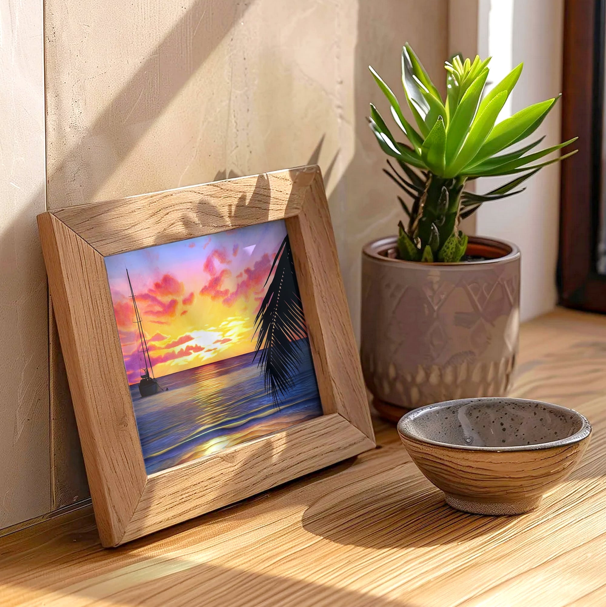 Impression d'art d'une peinture d'un coucher de soleil sur la mer à tahiti avec un bateau posée sur un meuble pour un style tropical exotique